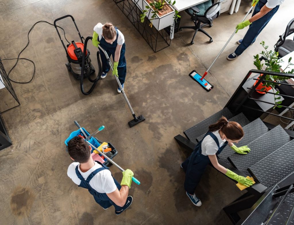 Commercial cleaning supervisor performing quality assurance inspections to maintain consistent cleaning standards